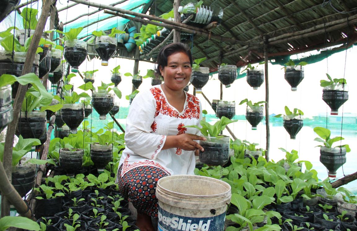 Sreymom is a community leader from Cambodia who has received sustainable farming training, reducing her expenses.