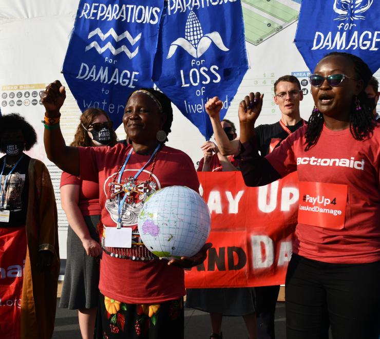 ActionAid staff and activist protest at COP27 campaigning for a loss and damage funding facility.