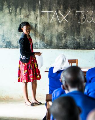 Hearing-impaired girls learning about education funding through tax justice in Tanzania.